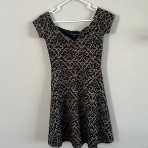 Sparkly patterned black and gold dress. Can be off the shoulder